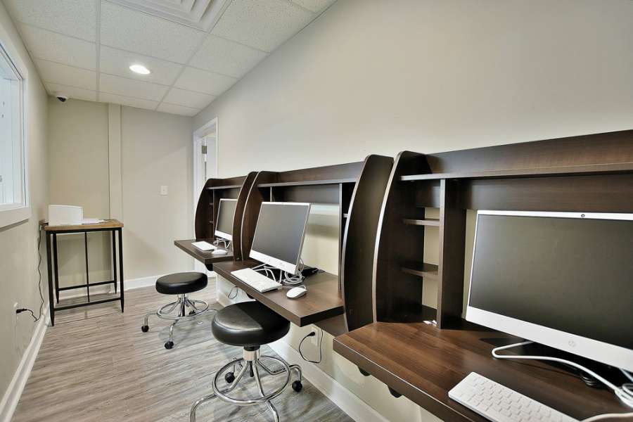 a room with computers on the shelves
