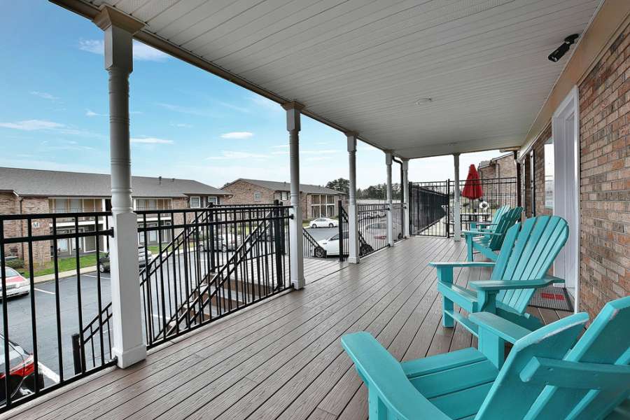 a deck with chairs on it