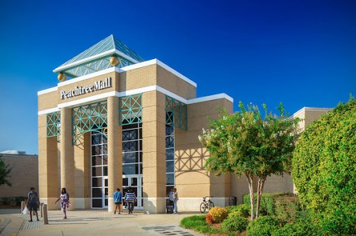 a building with people walking in front of it