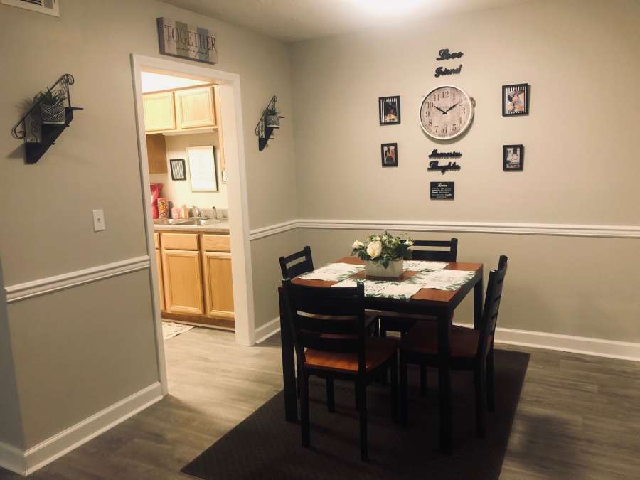 a dining table and chairs in a room